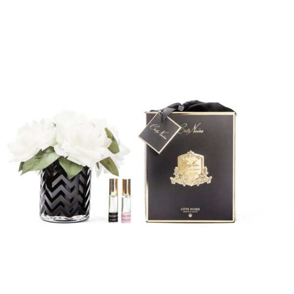 Rose rosa chiaro in vaso nero a spina con 2 profumazioni spray 10 ml